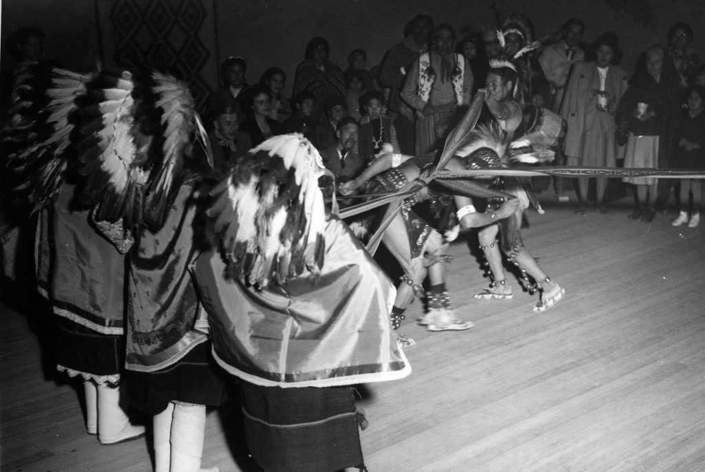 Pueblo dancers performing for Manhattan Project employees. Photo courtesy of the Robert JS Brown Collection.